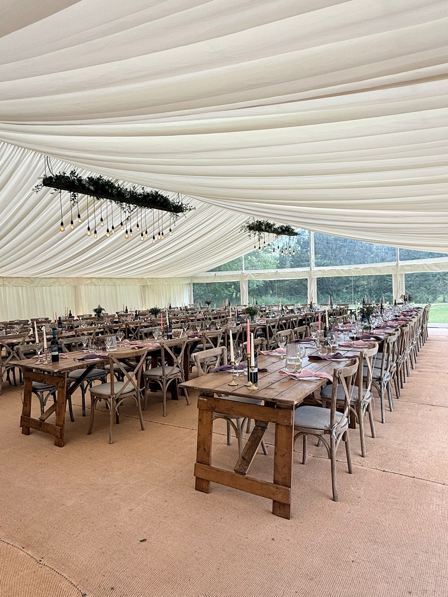 Long banquet tables dressed for a wedding breakfast
