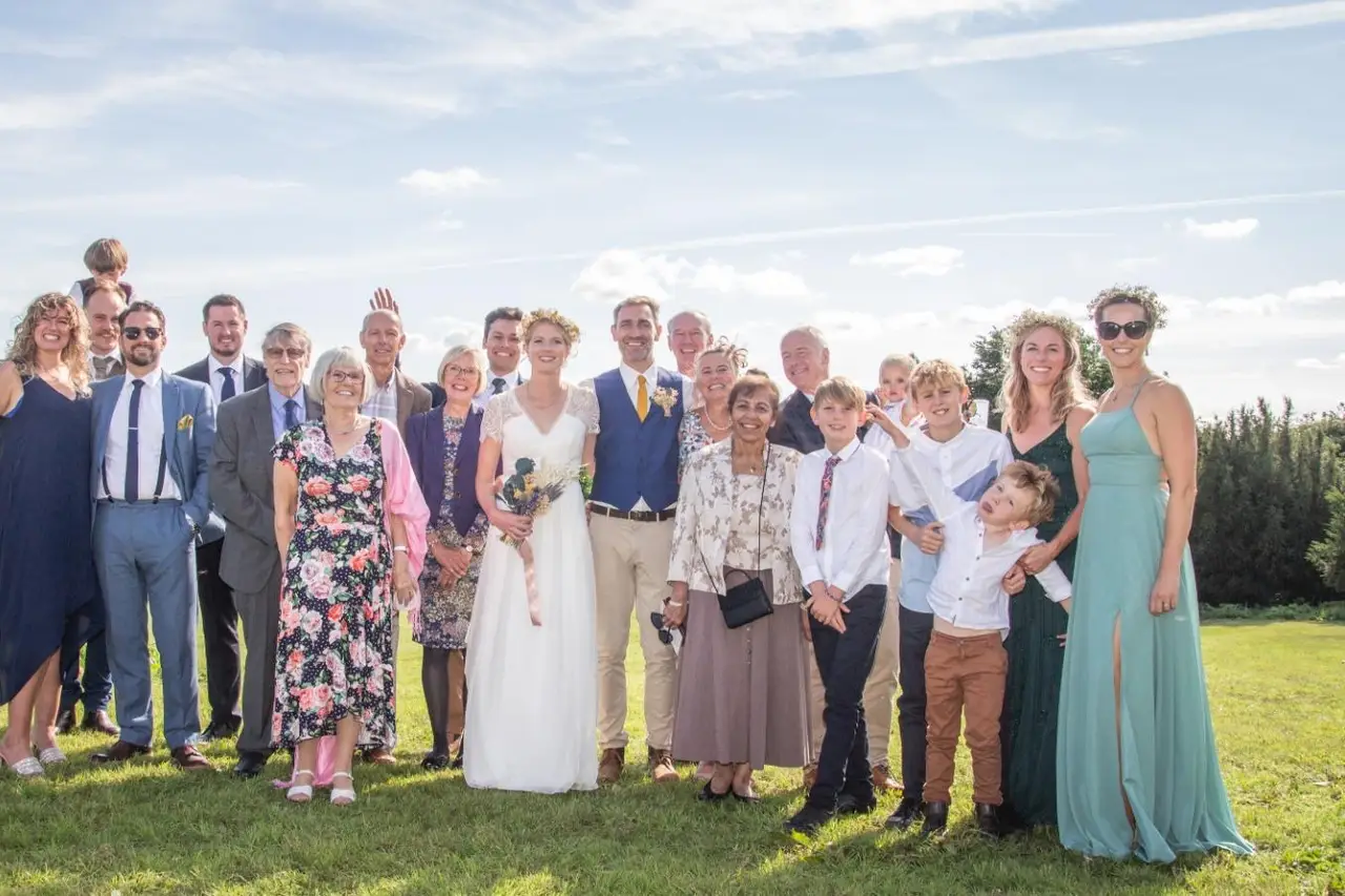 Wedding party gathered together in the Cotswolds countryside