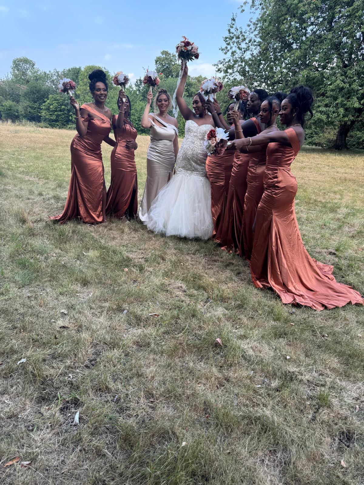 Bride with her bridal party at a wedding coordinated by E&M